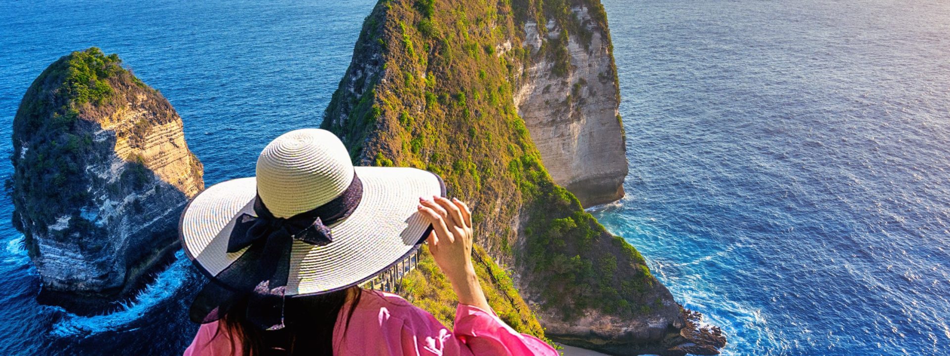 Woman walking at Kelingking Beach in Nusa penida island, Bali, Indonesia.